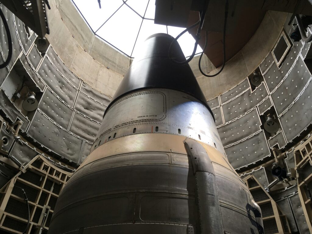 America Is In. Nuclear threat symbol inside missile launch silo